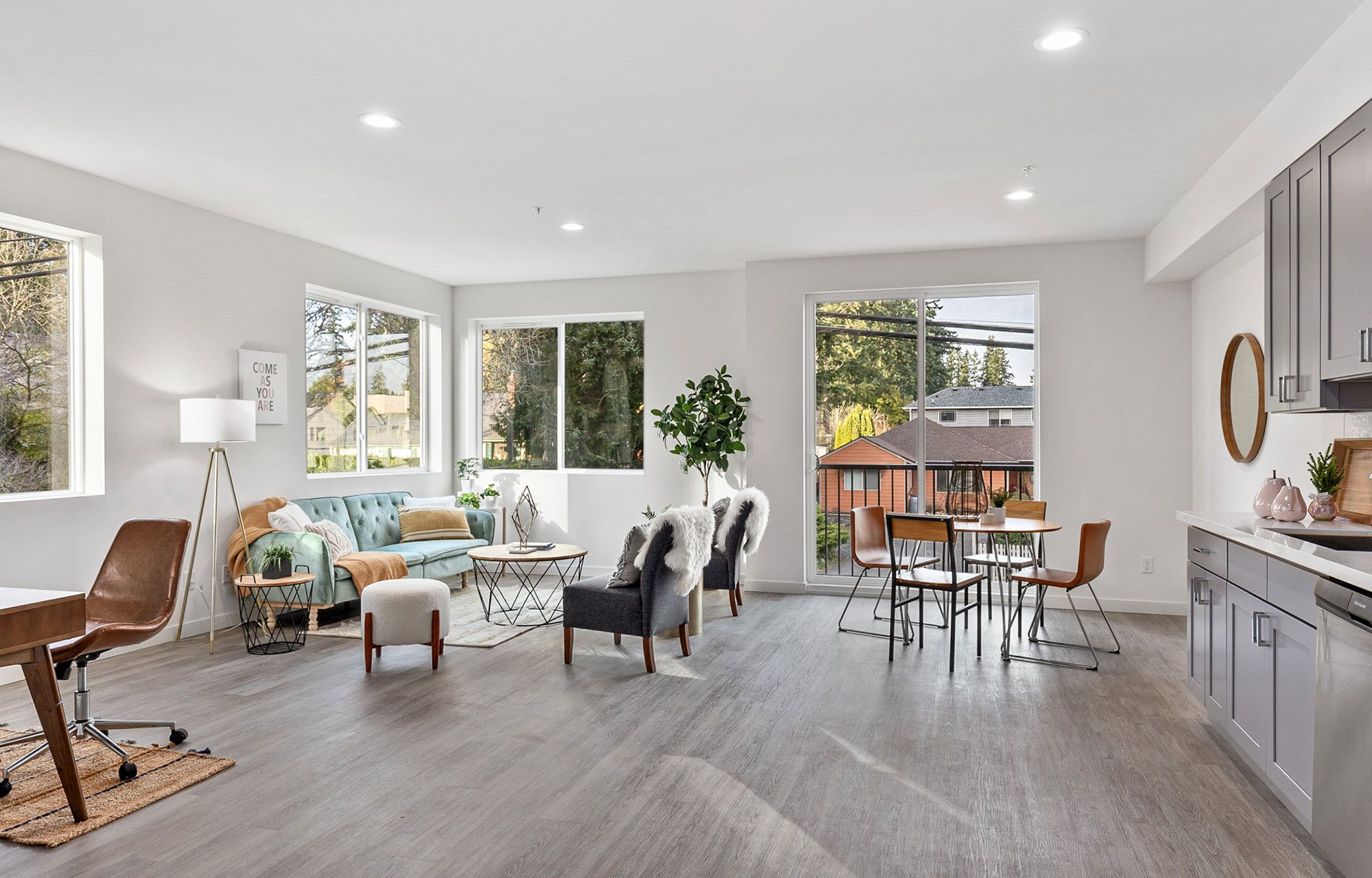Spacious open-plan living and dining area filled with natural light